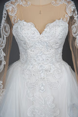 Elegant Long Sleeve Ruffled Ball Gown Wedding Dress Featuring Lace Appliques