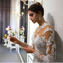 Elegant Sweetheart A-Line Wedding Gown with Long Sleeves and Lace Appliques