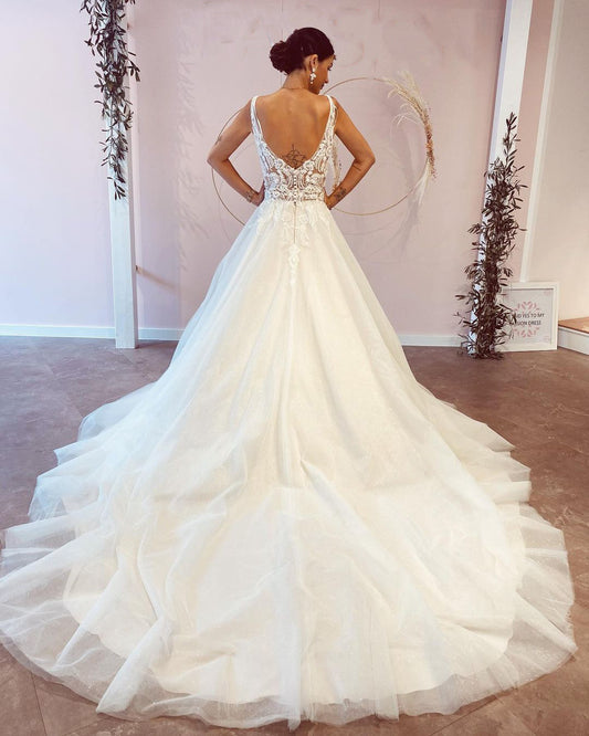 Elegant Backless A-Line Wedding Dress with Deep V-Neck and Lace Appliques