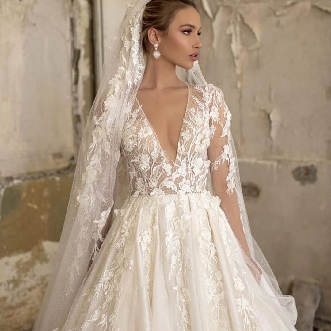 Elegant Deep V-neck A-Line Wedding Gown with Long Sleeves and Tulle Lace Ruffles
