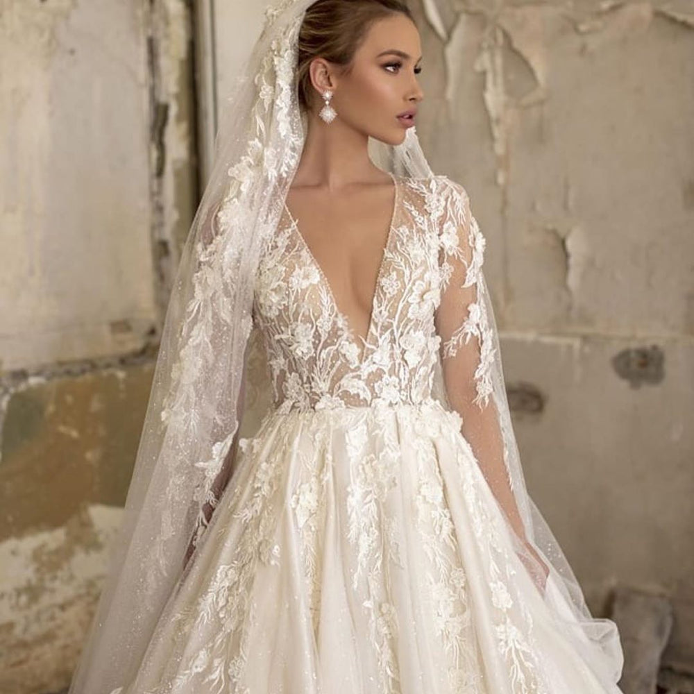 Elegant Deep V-neck A-Line Wedding Gown with Long Sleeves and Tulle Lace Ruffles