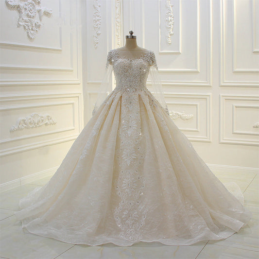 Elegant Beaded Bateau Ball Gown Wedding Dress with Lace Appliques and Long Sleeves