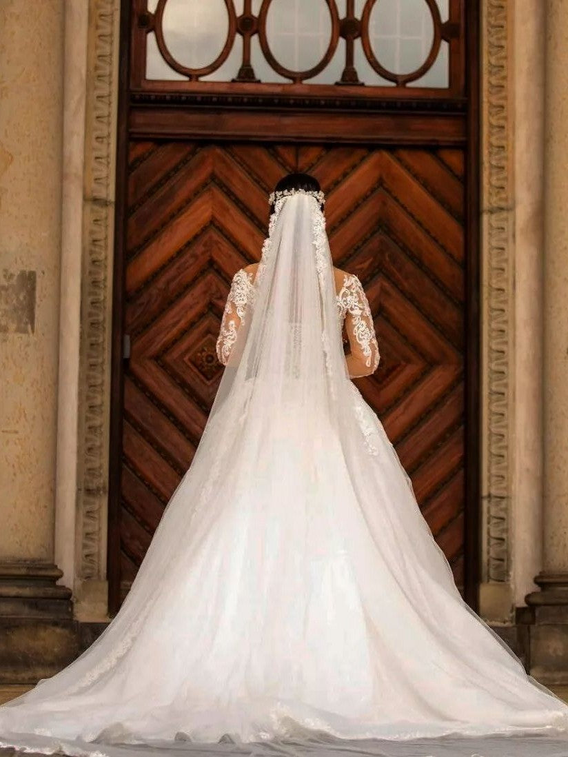 Elegant Off-the-shoulder Mermaid Wedding Dress with Long Sleeves and Lace