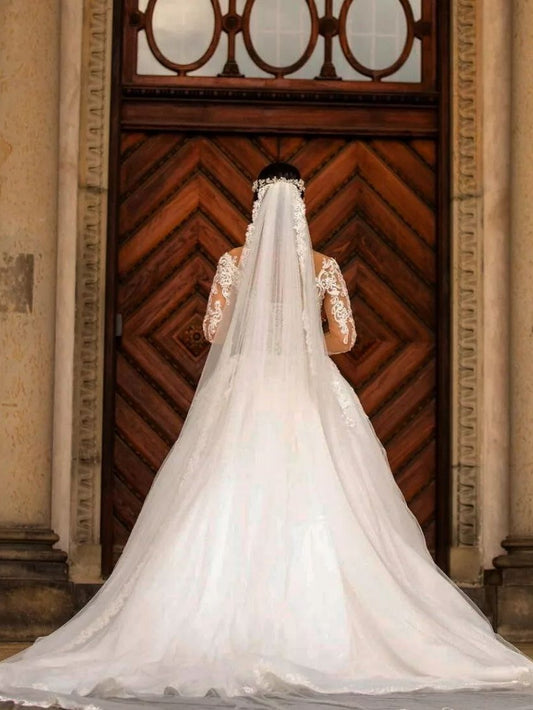Elegant Off-the-shoulder Mermaid Wedding Dress with Long Sleeves and Lace