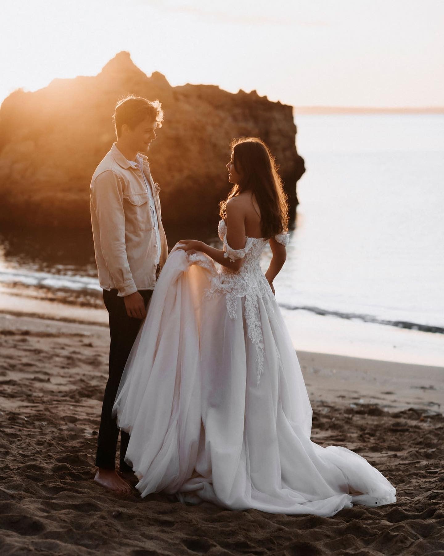 Elegant Off-the-shoulder A-Line Wedding Dress with Lace Appliques and Tulle Train