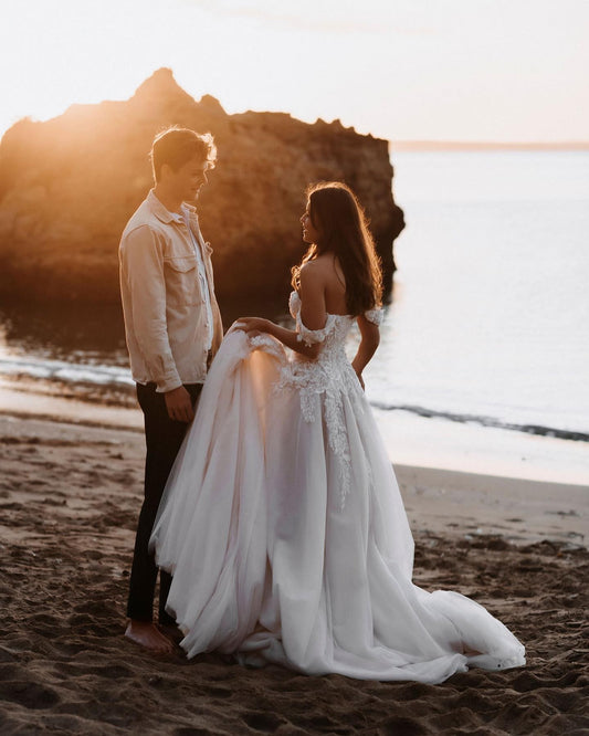 Elegant Off-the-shoulder A-Line Wedding Dress with Lace Appliques and Tulle Train