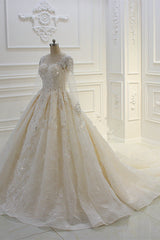 Elegant Beaded Bateau Ball Gown Wedding Dress with Lace Appliques and Long Sleeves