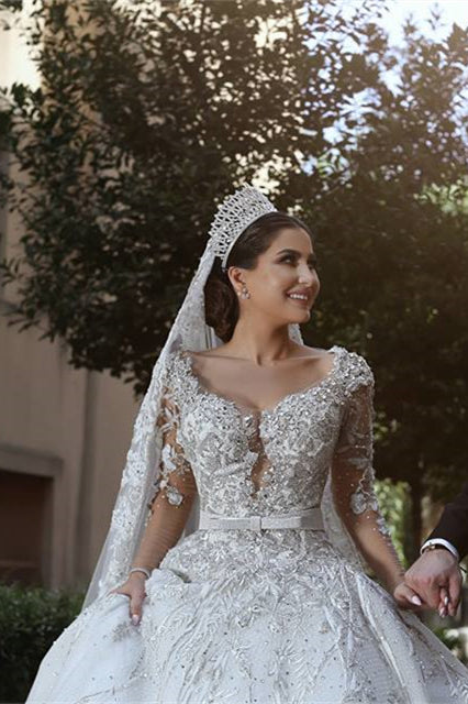 Wedding Dress with Long Sleeves, Beads, and Lace Appliques in a Ball Gown Style