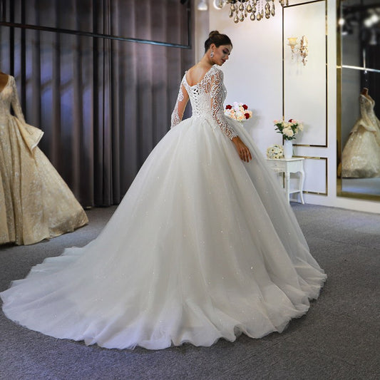 Sophisticated Floor-length A-Line Wedding Gown with Bateau Neckline, Long Sleeves, and Lace Appliques Sequins
