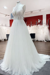 Elegant A-line Wedding Dress with V-neck, Sequins, Tulle Ruffles, and Backless Design