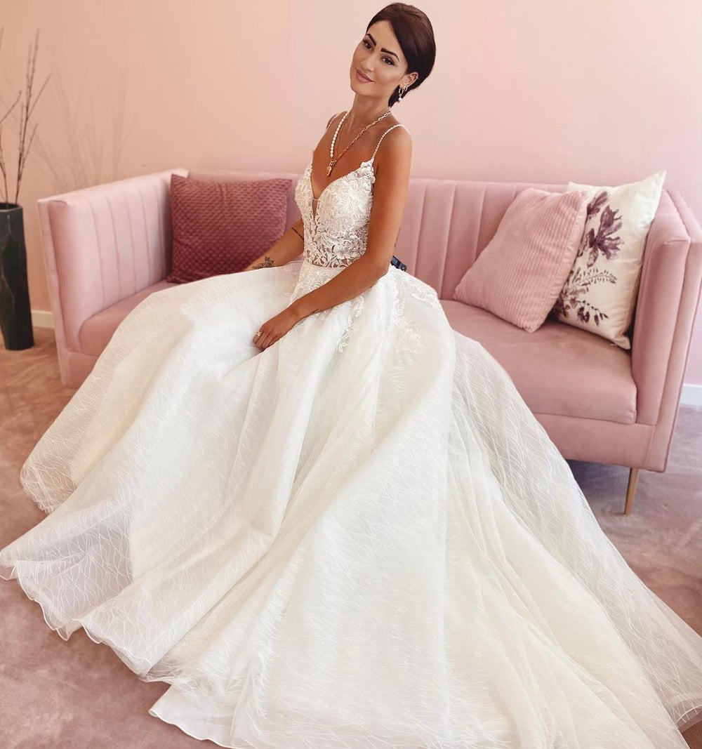 A-Line Wedding Dress with Elegant V-neck, Spaghetti Straps, and Appliques Lace Tulle