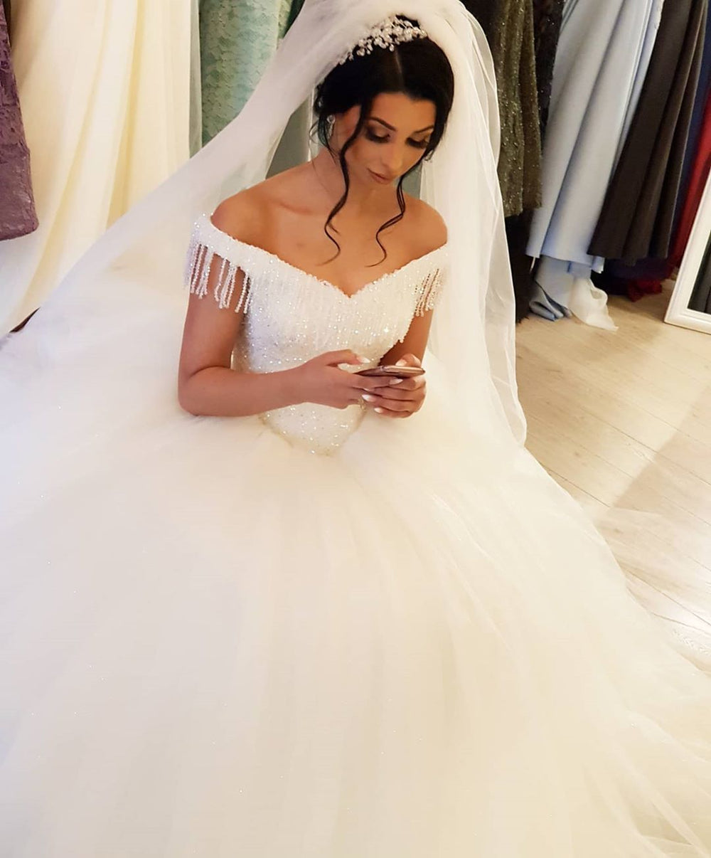 Off-the-shoulder Beaded Backless Wedding Gown with Elegant Floor-length Tassel Tulle