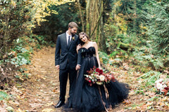Elegant strapless black A-line wedding gown with lace appliques and tulle
