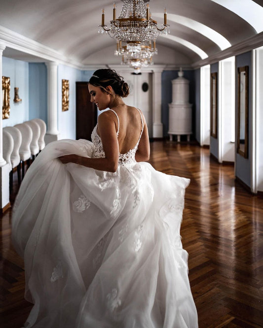 Elegant A-line Tulle Wedding Dress with Spaghetti Straps and Lace