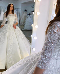 Elegant Satin Princess Bateau Wedding Gown with Long Sleeves and Lace Appliques