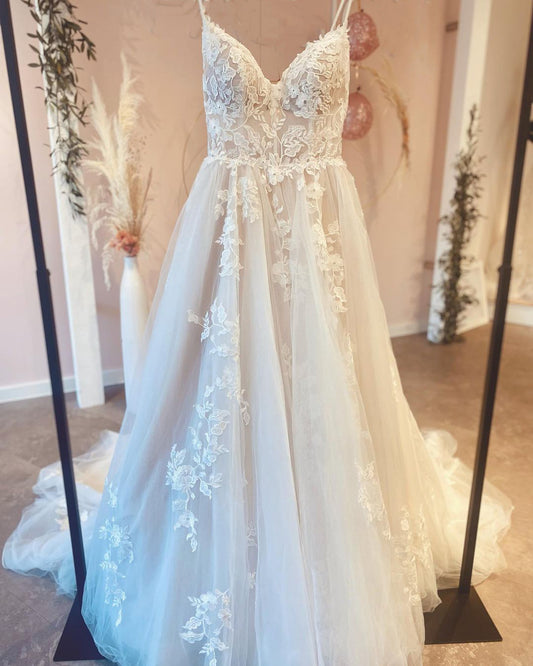 Elegant A-Line Wedding Dress with Spaghetti Straps, Floor-length Train, and Lace Appliques