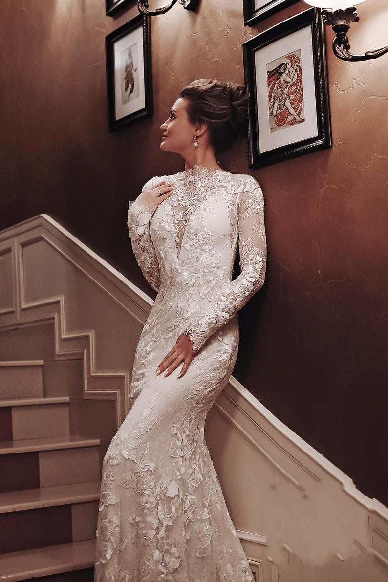 Elegant Backless Mermaid Wedding Gown with Vintage High Neck, Long Sleeves, and Lace Appliques