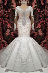 Elegant Sweetheart Mermaid Wedding Dress with Long Sleeves, Lace Appliques, and Beadings Ballbellas