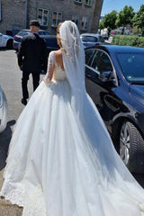 Elegant white lace wedding dress featuring a V-neck and long sleeves in an A-line silhouette