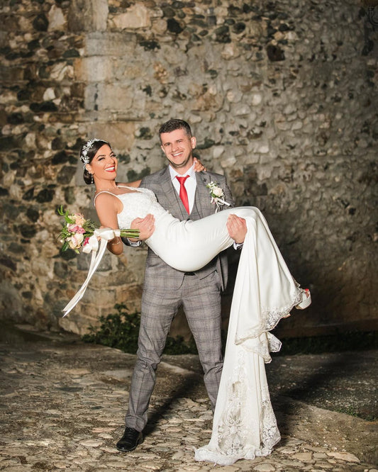 Elegant Mermaid Wedding Gown with Spaghetti Straps, V-neck, and Lace Details