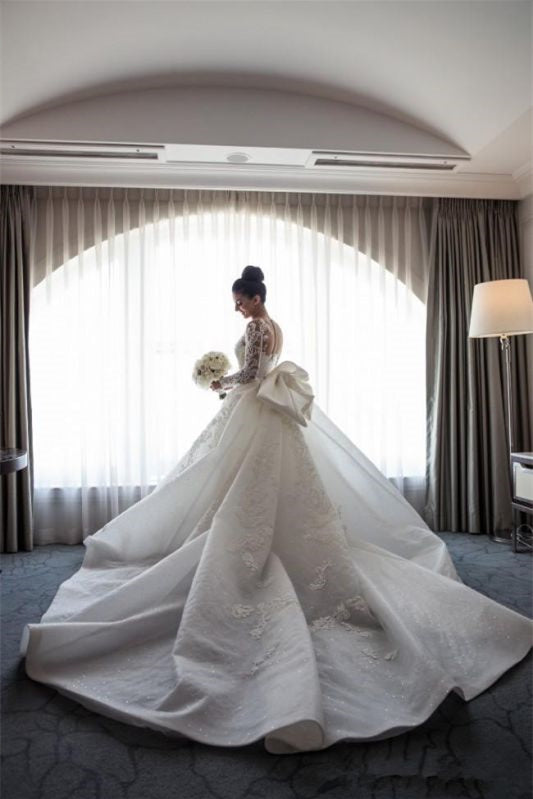 Stunning Mermaid Lace Wedding Gown with Long Sleeves and Detachable Bowknot Skirt