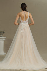 Elegant Backless A-line Wedding Dress with Floral Appliques and Chic Straps