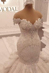 Elegant Off-The-Shoulder Mermaid Wedding Dress with Crystal Details and Backless Design