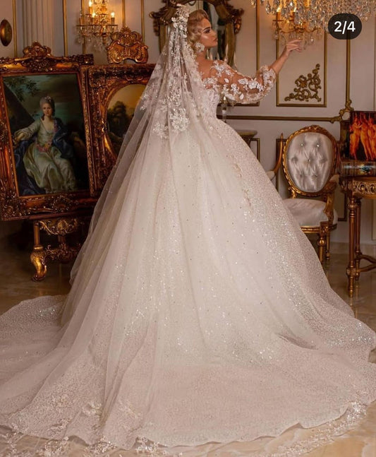 Elegant Ball Gown Wedding Dress Featuring Long Puffy Sleeves and Appliques