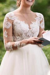 Elegant Floor-Length Sheer Lace Wedding Dress With Long Sleeves and Tulle A-Line