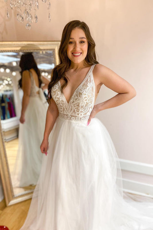 Contemporary A-Line Wedding Gown with Deep V-Neck, Spaghetti Straps, and Tulle Train