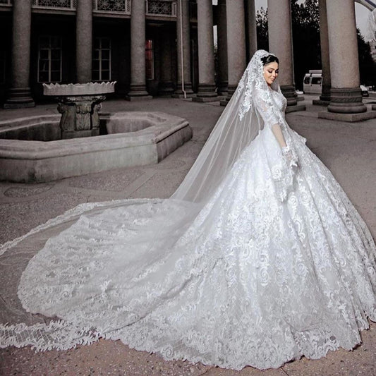 Elegant Princess Wedding Gown with Chic Bead Appliques and Long Sleeves in Tulle