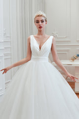 Elegant A-Line Wedding Gown with Deep V-Neck and Wide Tulle Straps