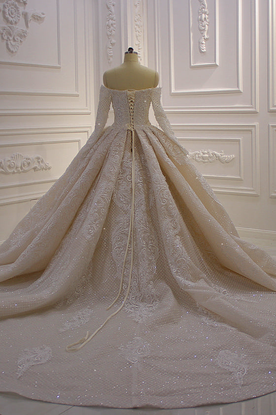 Elegant Off-The-Shoulder Ball Gown Wedding Dress with Lace Appliques and Long Sleeves