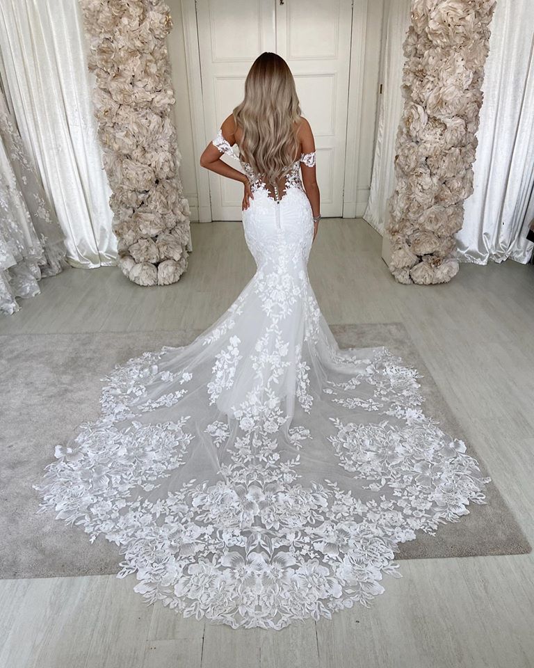 Elegant Backless Mermaid Wedding Gown with Lace and Off-The-Shoulder Design
