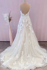 Elegant A-Line Wedding Gown with Spaghetti Straps, Tulle Skirt, and Lace Appliques