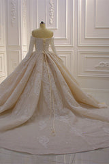 Elegant Off-The-Shoulder Ball Gown Wedding Dress with Lace Appliques and Long Sleeves