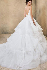 V-neck A-line Wedding Dress with Elegant Ruffles, Spaghetti Straps, and Tulle Backless Design