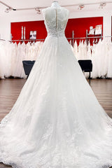 Elegant A-line Jewel Tulle Wedding Gown Featuring Lace Appliques