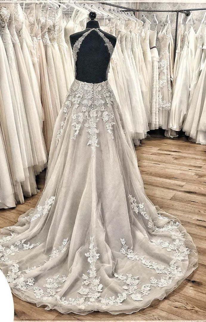 Elegant Backless Halter Wedding Dress with Lace Appliques and Tulle Ruffles