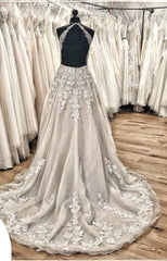Elegant Backless Halter Wedding Dress with Lace Appliques and Tulle Ruffles