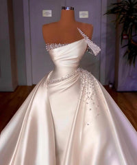 Elegant White Mermaid Bridal Gown with One Shoulder and Pearl-Adorned Detachable Skirt
