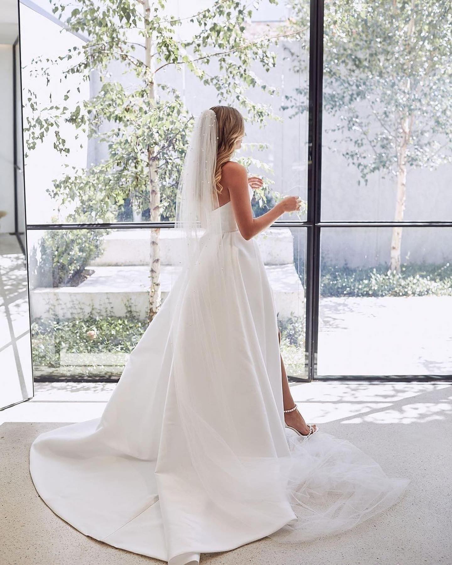 Elegant Sweetheart A-Line Satin Wedding Dress with Floor-length Ruffled Slit