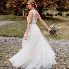 Elegant Floral A-Line Wedding Dress with Deep V-neck and Open Back