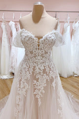 Elegant A-Line Off-the-Shoulder Wedding Gown Featuring a Backless Sweetheart Tulle Train