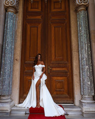 Elegant Off-The-Shoulder Satin Mermaid Wedding Gown Featuring a Slit