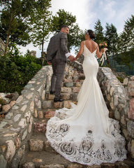 Elegant Mermaid Wedding Gown with Spaghetti Straps, V-neck, and Lace Details