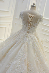 Elegant Beaded Bateau Ball Gown Wedding Dress with Lace Appliques and Long Sleeves