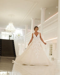 Elegant Backless A-Line Wedding Gown with Deep V-Neck and Spaghetti Straps in Applique Lace