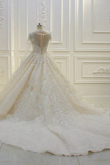 Elegant Beaded Bateau Ball Gown Wedding Dress with Lace Appliques and Long Sleeves