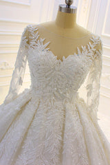 Elegant Long Wedding Dress with Beading, Lace Appliques, and Church Train Sleeves